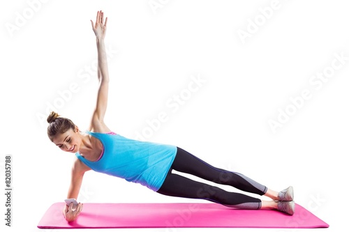 Fit woman doing side plank