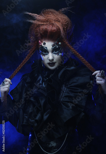 Gothic witch. Dark woman.