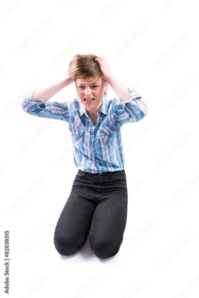 Pretty brunette getting a headache with hands on head