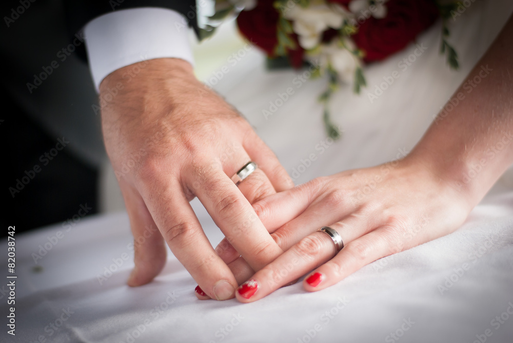 Wedding rings on fingers