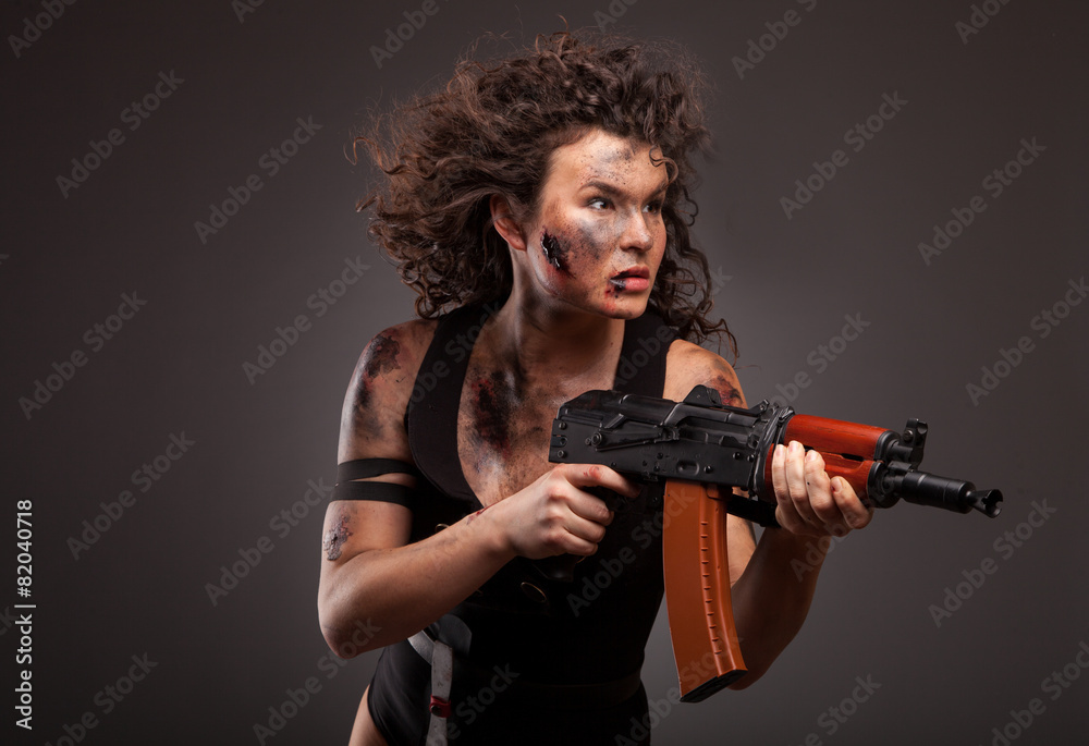 Beautiful woman with gun ak 47