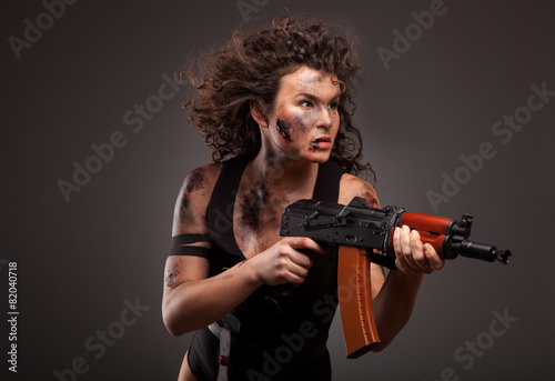 Beautiful woman with gun ak 47 © Dmytro Sandratskyi