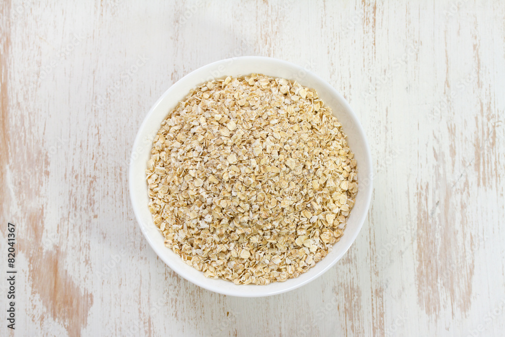 oat on white bowl oat on white bowl