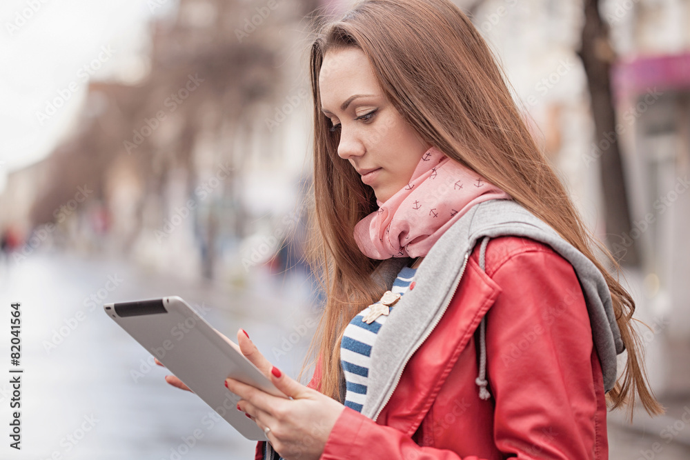 Young woman with a digital tablet