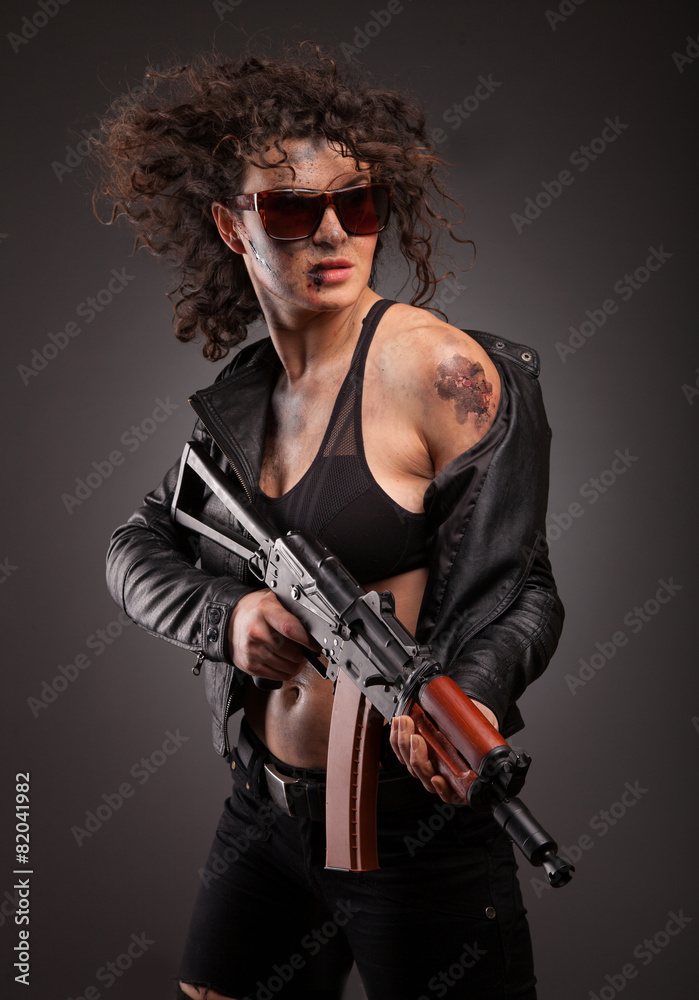 Beautiful woman with gun ak 47