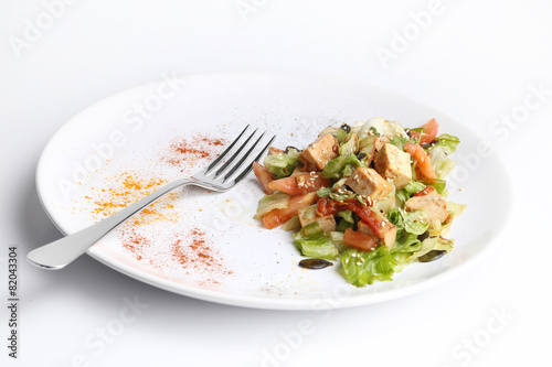 Tofu and vegetables salad isolated on white background photo
