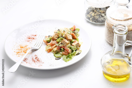 Tofu and vegetables salad. Olive oil, spices, pumpkin and sesame photo
