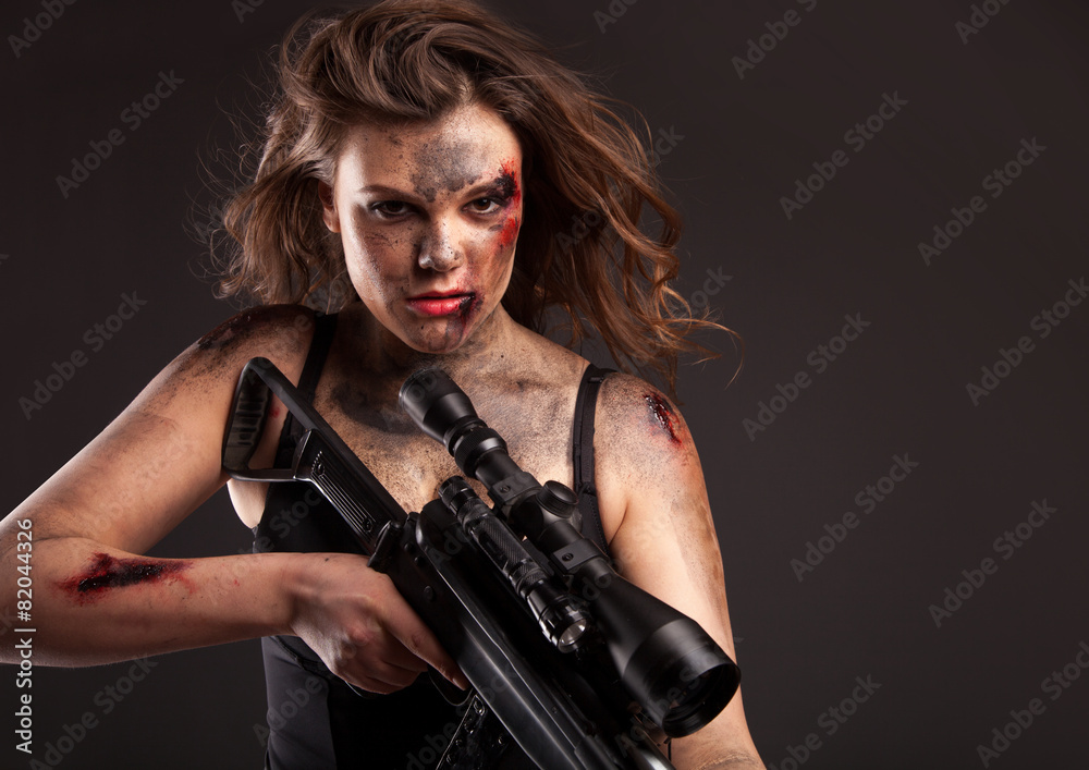 Riot girl with sniper gun close up portrait. Riot girl with sniper gun close up portrait.