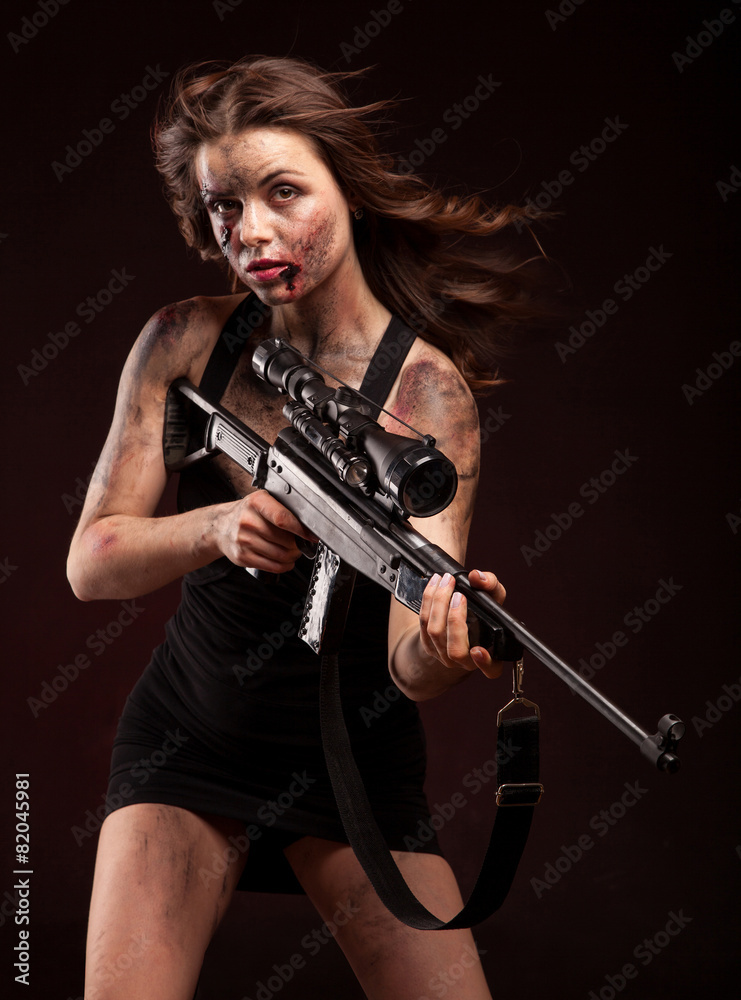 girl with sniper gun close up portrait. With blood and wound girl with sniper gun close up portrait. With blood and wound