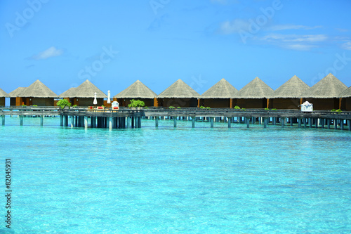 Water villas over blue ocean in baros Maldives