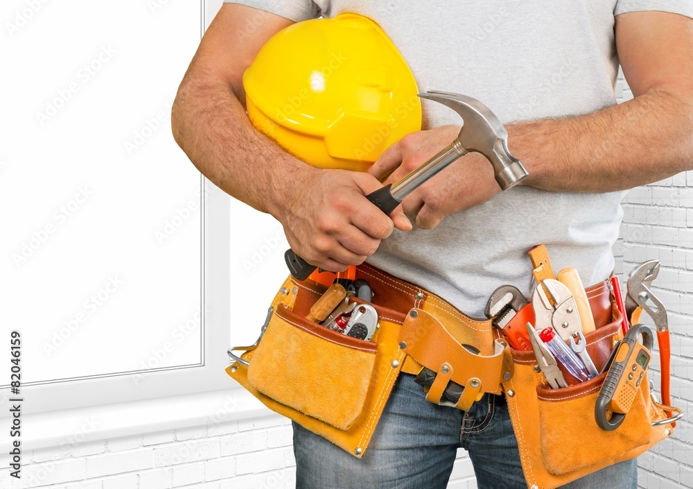Adjustable. Handyman with a tool belt. House renovation service. Adjustable. Handyman with a tool belt. House renovation service.