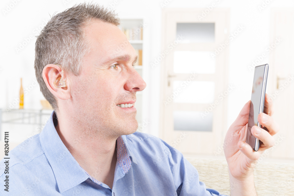 Deaf man using mobile phone Deaf man using mobile phone