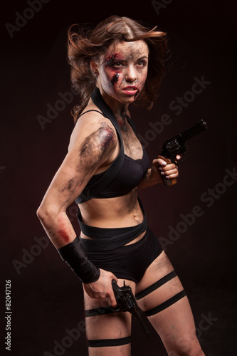 Woman warrior posing with knife. Ready to fight. With dirty face © Dmytro Sandratskyi