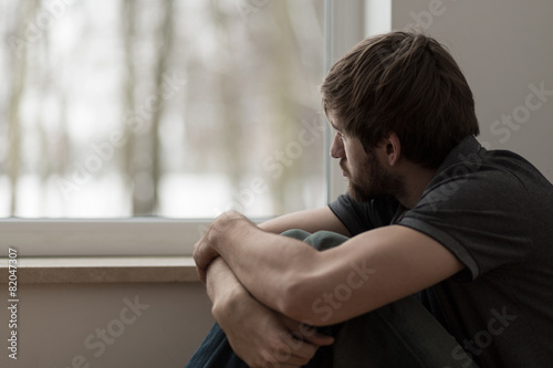 Young man suffering for depression photo