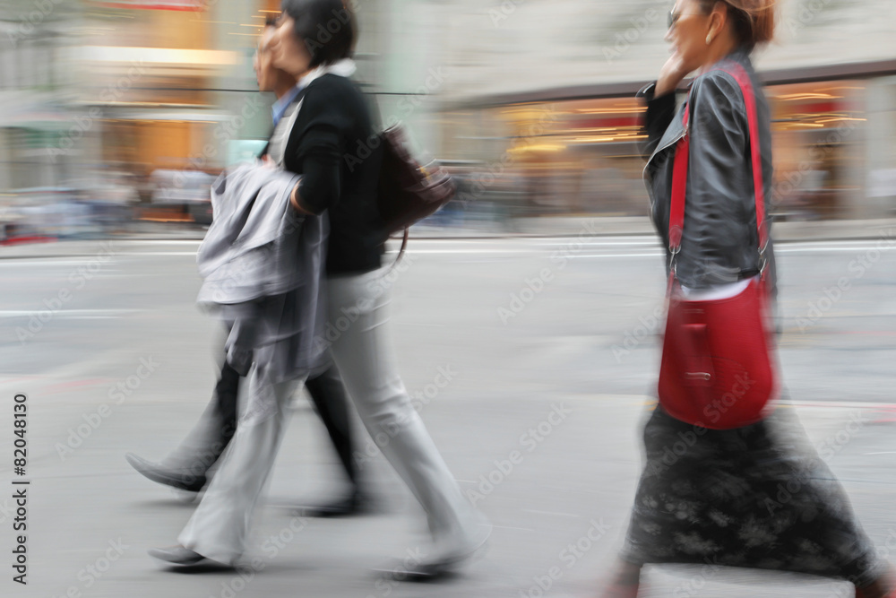 motion blurred business people walking on the street motion blurred business people walking on the street