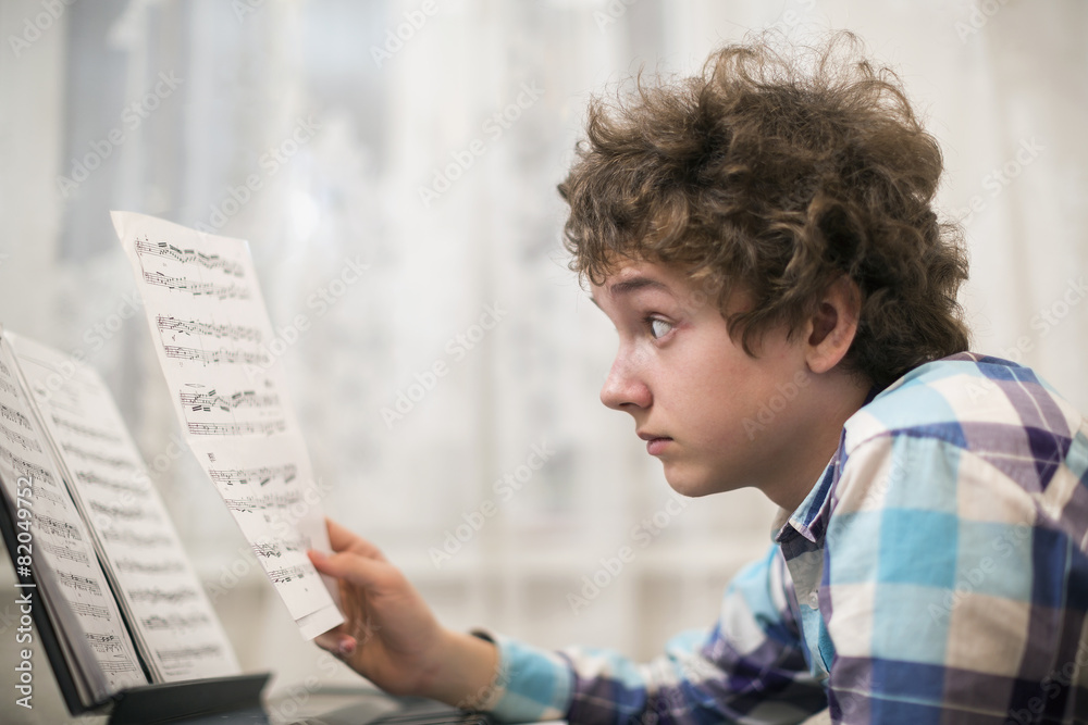 boy plays piano boy plays piano