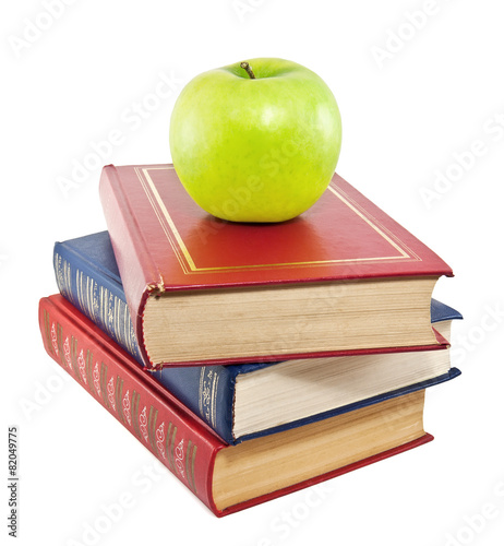 Apple on top of stack of old books