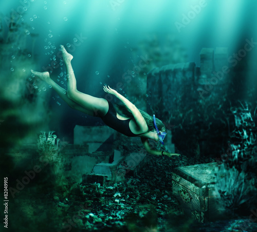 Woman swimming underwater. Adventure