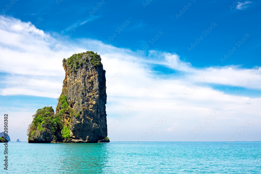 tropical beach with sea and limestone rock