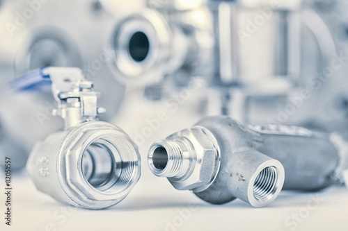 Fittings and ball valve with selective focus on thread fittings. photo