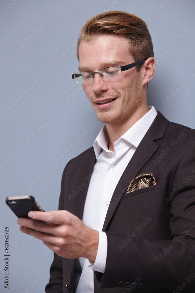 young businesswoman with phone in hand