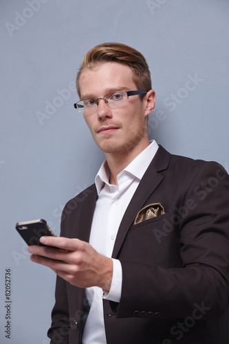 young businesswoman with phone in hand