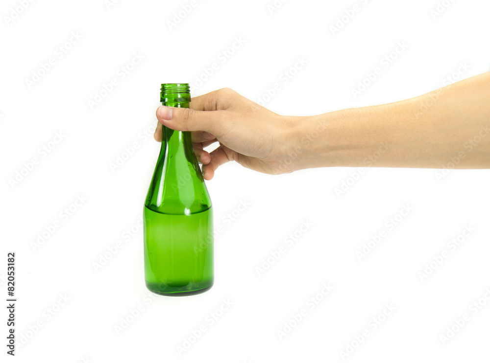 hand holding beer in green bottle on white background hand holding beer in green bottle on white background