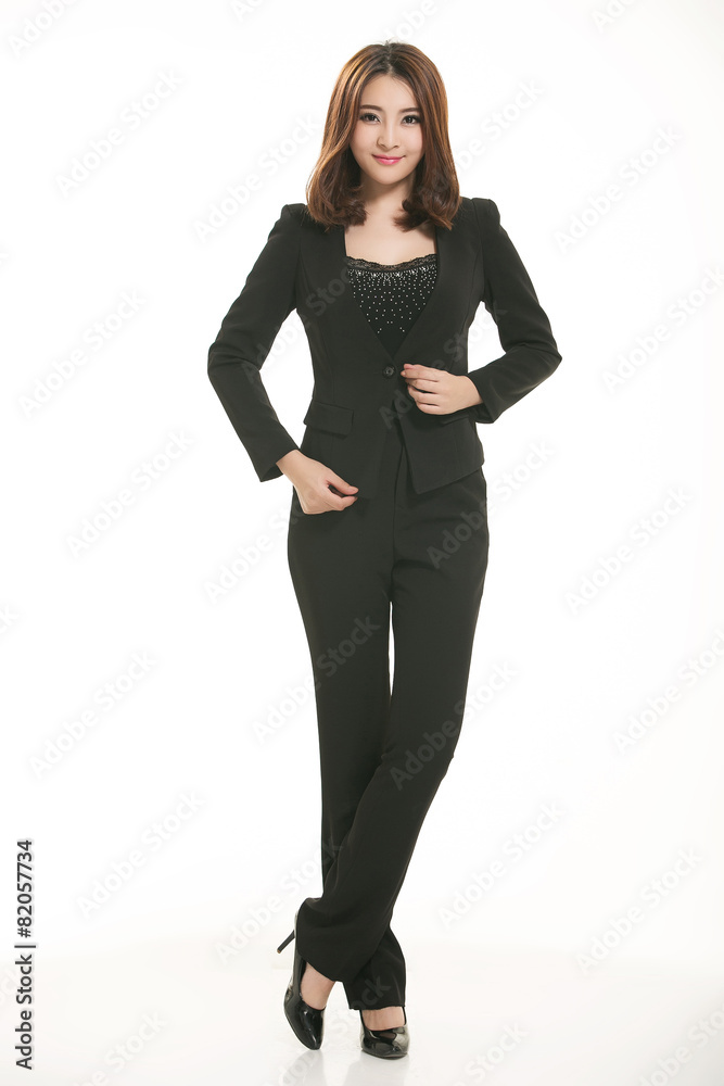Young Asian women wearing a suit in front of a white background Young Asian women wearing a suit in front of a white background