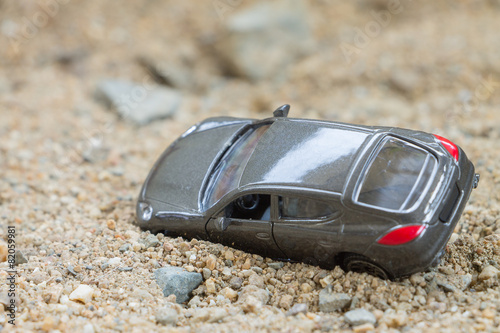 Toy car on a sand background © Sirichai Puangsuwan