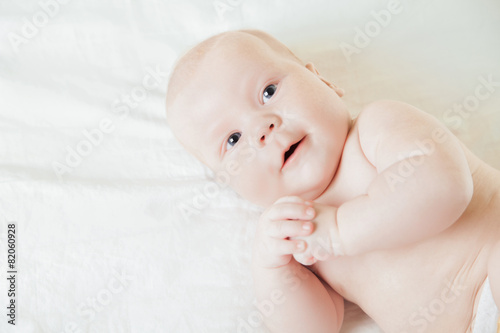 Newborn Baby Lying on Back looking aside