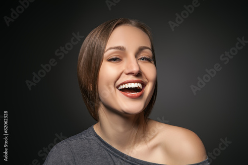 Lovely girl looking at camera with a wide smile