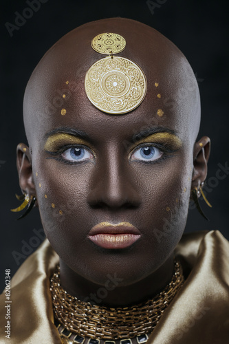 Portrait African woman with traditional national pattern on head