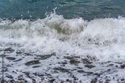 Sea waves on a pebbly shore