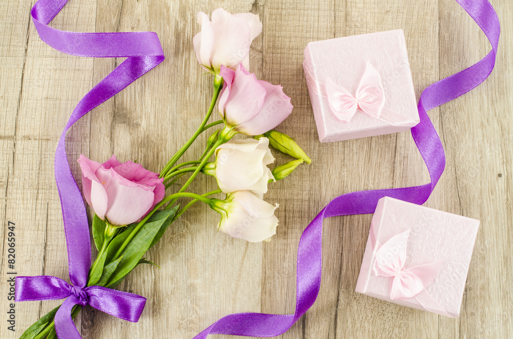 Pink flower and gift box on wooden background Pink flower and gift box on wooden background