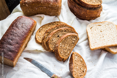 assortment of baked bread, slices of rye bread, bran cereal, rus