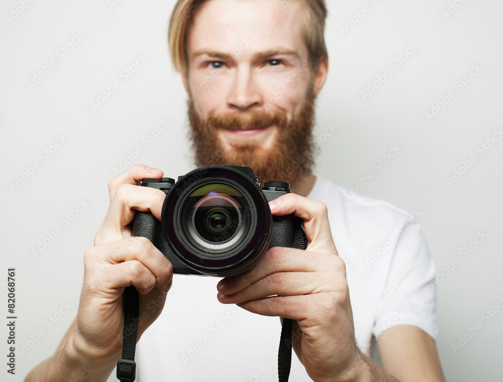 Young bearded  photographer