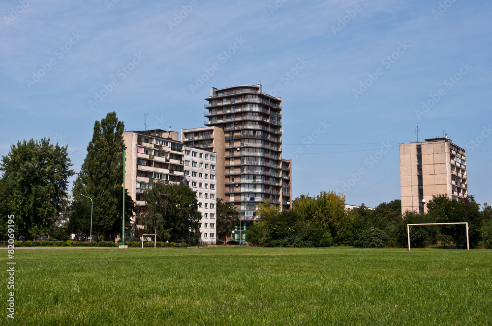Outdoor Soccer Field with Modern and Old Residential Buildings
