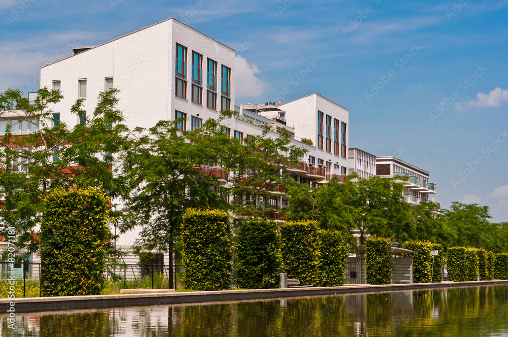 Modern Dutch Architecture with Bushes and Trees