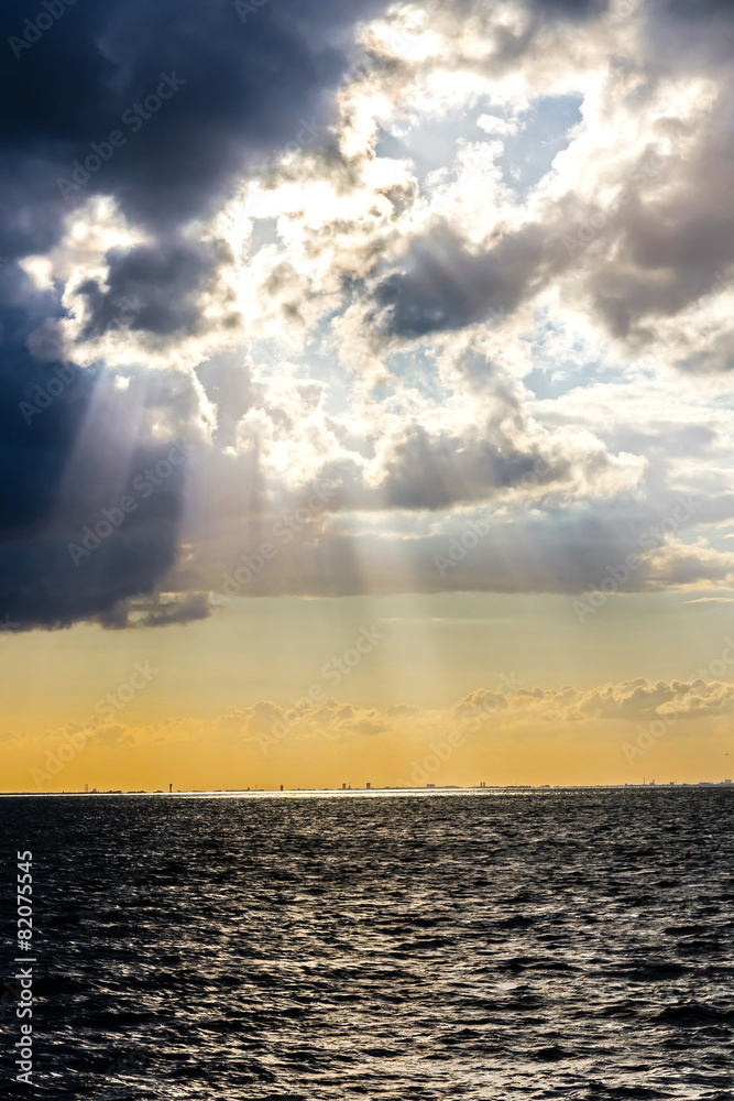 Sun beams through stormy clouds over Baltic Sea in Malmo