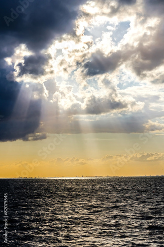 Sun beams through stormy clouds over Baltic Sea in Malmo