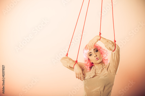 woman girl stylized like marionette puppet on string