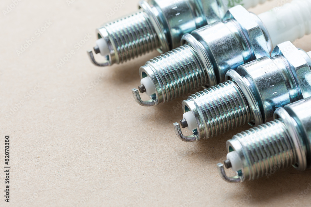 Auto service. Set of spark plugs as spare part of car. Auto service. Set of spark plugs as spare part of car.