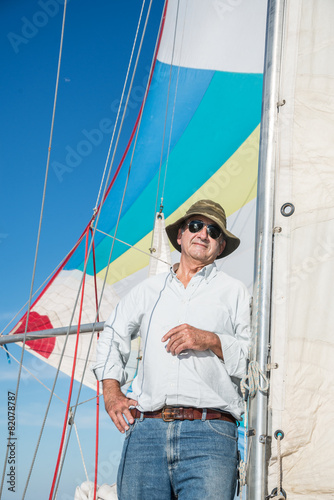 Senior retired sailing Buenos Aires River to Uruguay. Sport free