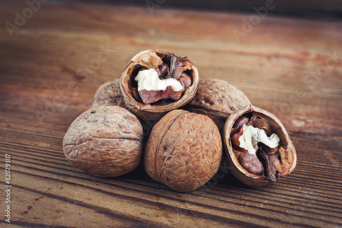 Wallpaper Mural Walnut kernels and whole walnuts wood background Torontodigital.ca