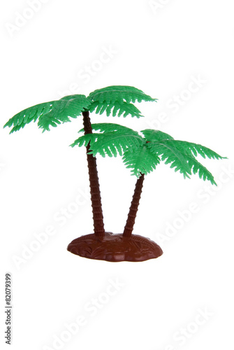 Plastic palm tree toy isolated on white background