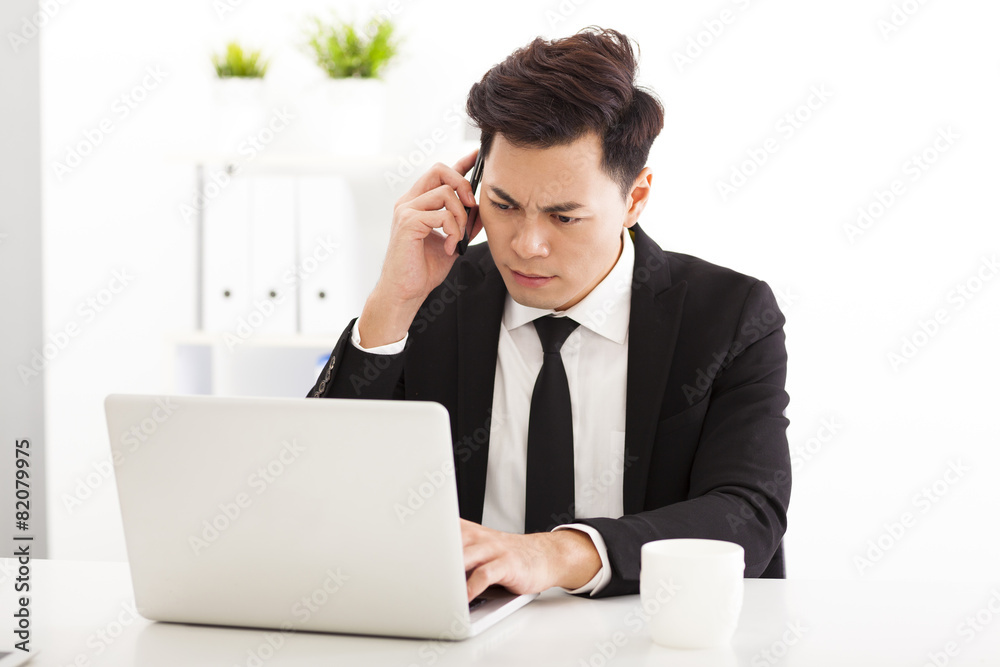 upset business man working in the office upset business man working in the office