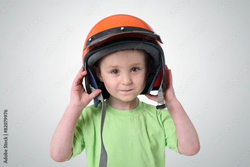 Portrait of a little boy in a motorcycle helmet Portrait of a little boy in a motorcycle helmet