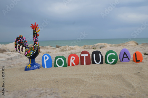 Portugal, souvenir on colored stones with Rooster of Barcelos photo