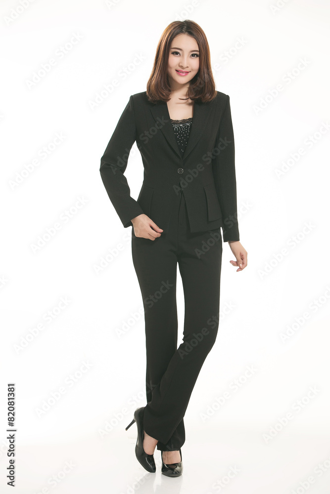 Young Asian women wearing a suit in front of a white background Young Asian women wearing a suit in front of a white background