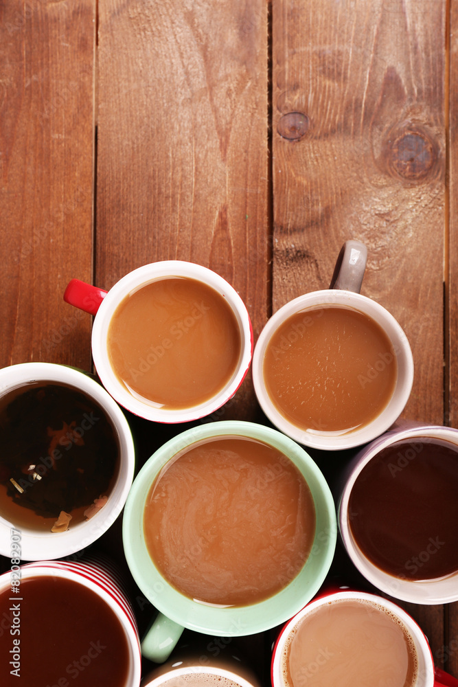 Cups of cappuccino on wooden table, top view Cups of cappuccino on wooden table, top view